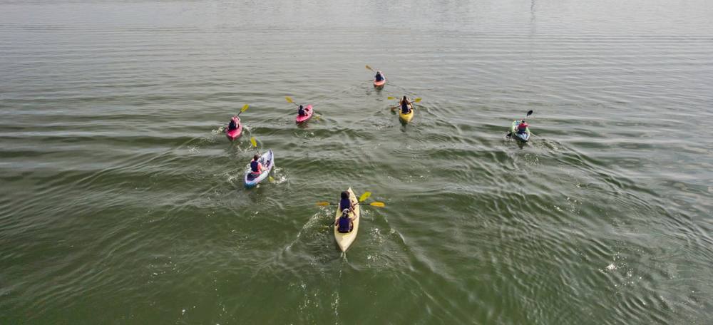 Aerial view of guests kayaking a Florida waterway on a ChoZen kayak tour