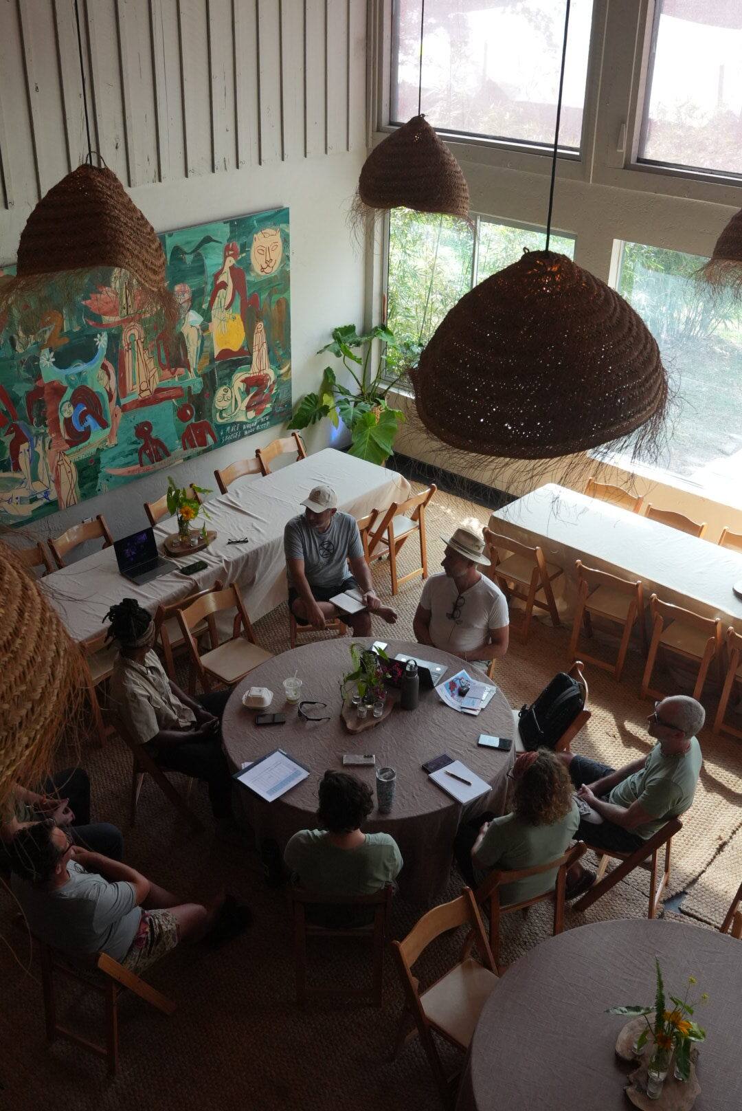 Group meeting around a table in The Hearth Living Room at ChoZen